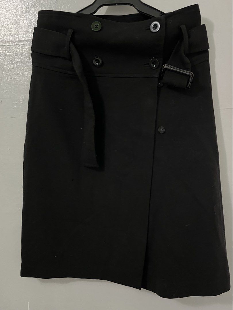 Zara Basic Black Belted Wrap Skirt (Category: Skirts) located in Antipolo. Submitted by starraid777 (Listing ID 1461852728, Image 1). Description: - Zara Basic black wrap skirt - Size: Medium (M) - Features a belt with buckle closure - Double button detail at the waist .