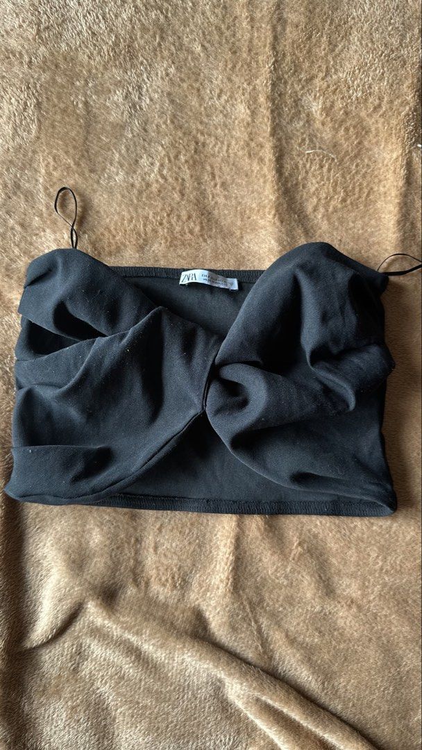Zara Black Twisted Front Crop Top (Category: Others Tops) located in Mandaluyong City. Submitted by yv.stuff (Listing ID 1461832900, Image 1). Description: - Zara crop top - Twisted knot detail at the front - Spaghetti straps - Versatile: great for casual days or nights out - Comfortable and easy to style.