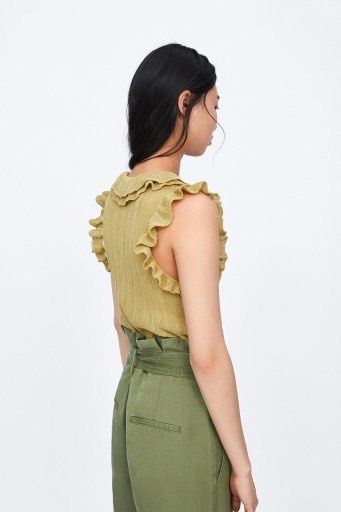 Zara knitted frill blouse (Category: Blouses) located in Manila. Submitted by ourburstingwardrobe_ (Listing ID 1461846139, Image 2). Description: Size M Like new condition.