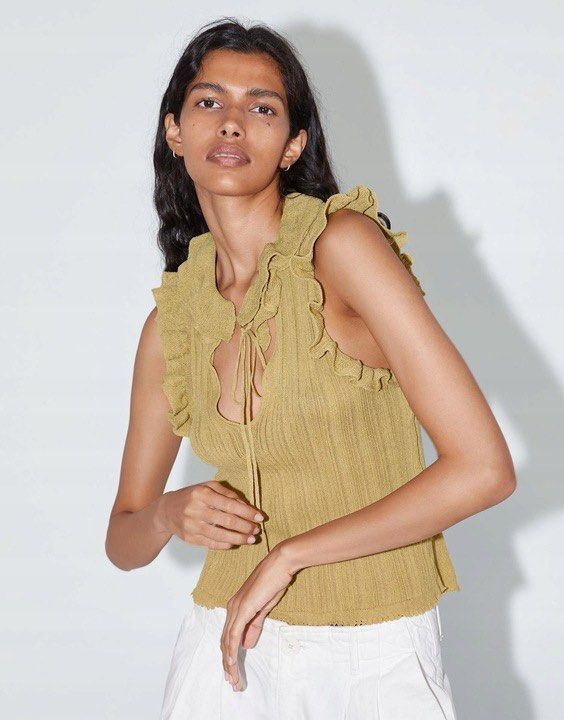 Zara knitted frill blouse (Category: Blouses) located in Manila. Submitted by ourburstingwardrobe_ (Listing ID 1461846139, Image 1). Description: Size M Like new condition.