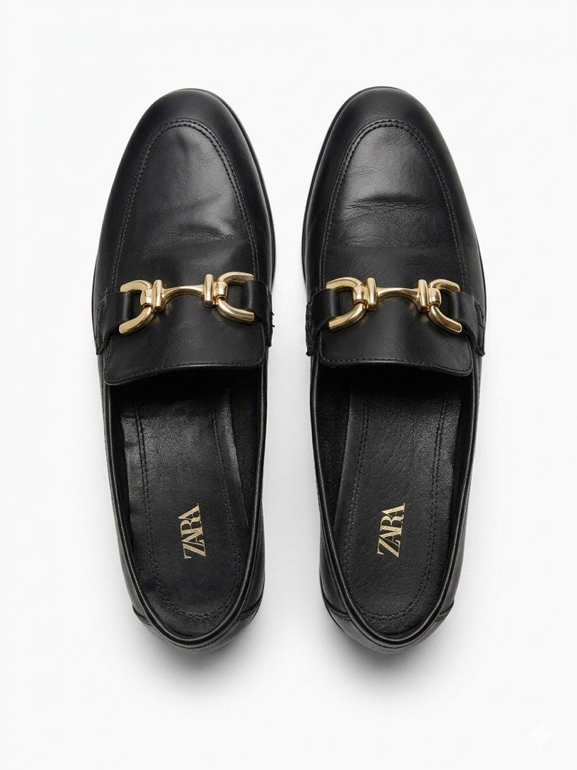 Zara Loafers (Category: Loafers) located in Paranaque City. Submitted by nami_zulueta (Listing ID 1461855375, Image 1). Description: Zara soft black leather loafers featuring a classic almond toe silhouette and a distinctive gold snaffle bit buckle across the instep. Known for their flexible, minimalist design, these flat slip-on loafers offer a polished look suitable for both smart-casual and formal workwear. .