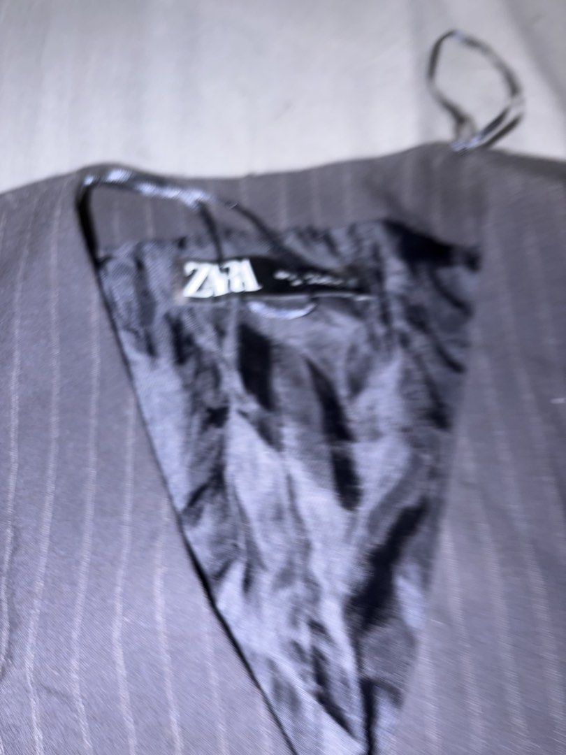 Zara Pinstripe Vest (Category: Sleeveless) located in Manila. Submitted by raymond28165 (Listing ID 1461906862, Image 2). Description: - Zara black pinstripe vest - Button-up front - Two functional pockets - Classic, versatile piece - Perfect for layering over shirts or dresses - Suitable for smart casual or formal occasions.
