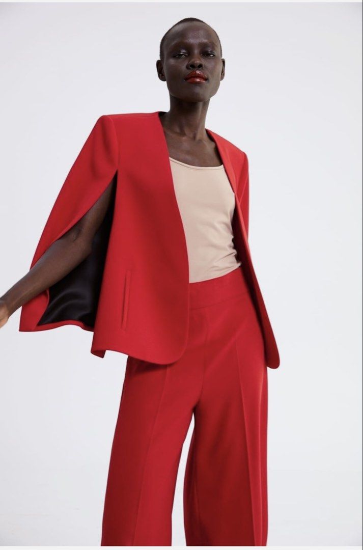 Zara Red Cape Blazer Jacket (Category: Coats, Jackets and Outerwear) located in Las Pinas. Submitted by everythingandanything00 (Listing ID 1461802158, Image 1). Description: - Zara red cape blazer orginal price is 6000 only used twice - Open front design - Features stylish split sleeves - Effortlessly transitions from casual to formal - Ideal for making a statement at work or on a night out - Pairs perfectly with jeans or trousers - it’s XL on t