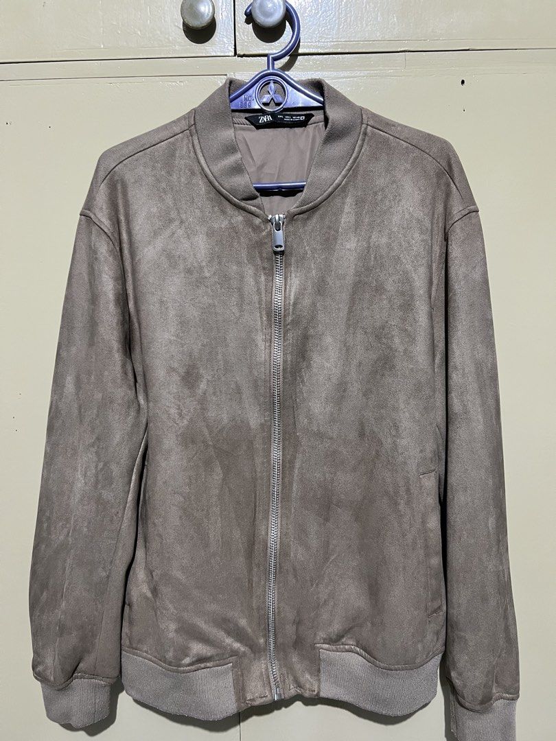 Zara Suede Bomber Jacket (Category: Coats, Jackets and Outerwear) located in Marikina City. Submitted by gucciiivpn (Listing ID 1461968001, Image 1). Description: - Zara Grey Suede Bomber Jacket - Classic bomber style - Zip-up front closure - Ribbed cuffs and hem for a snug fit - Perfect for casual outings or adding a touch of style to any outfit.