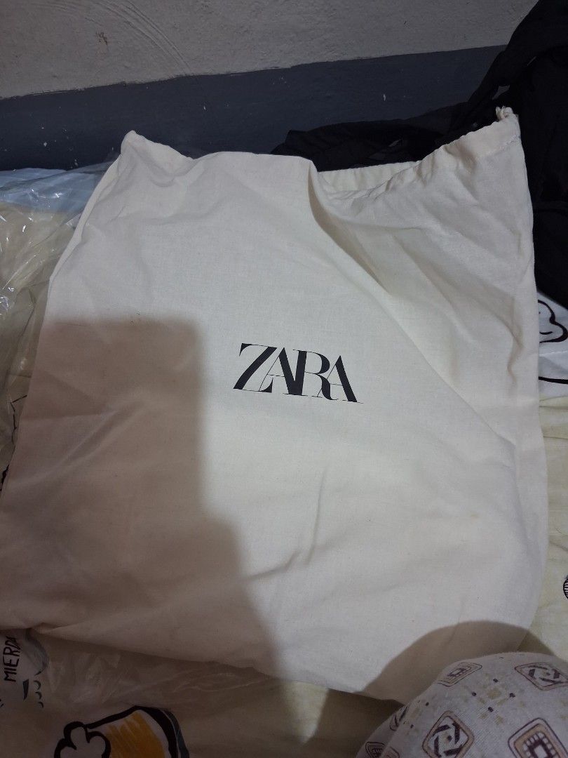 Zara White Ribbed Tank Top with Tags (Category: Sleeveless) located in Mandaluyong City. Submitted by hinalmhary33271 (Listing ID 1462021759, Image 3). Description: - Brand new Zara ribbed tank top - Original tags still attached - Comfortable, stretchy material - Square neckline with thin straps - Comes with a reusable Zara dust bag - Essential basic piece for any wardrobe.