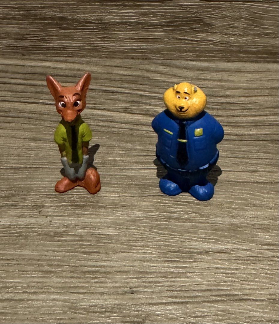 Zootopia Nick Wilde & Chief Bogo Figurines (Category: Figurines & Statues) located in Quezon City. Submitted by kcapi (Listing ID 1461956344, Image 1). Description: - Set of Zootopia figurines featuring Nick Wilde and Chief Bogo. - Nick Wilde is depicted wearing his iconic green shirt and handcuffs. - Chief Bogo is in his official police uniform. - Ideal for any Zootopia enthusiast or collector. - Fun and collectible pieces for display..