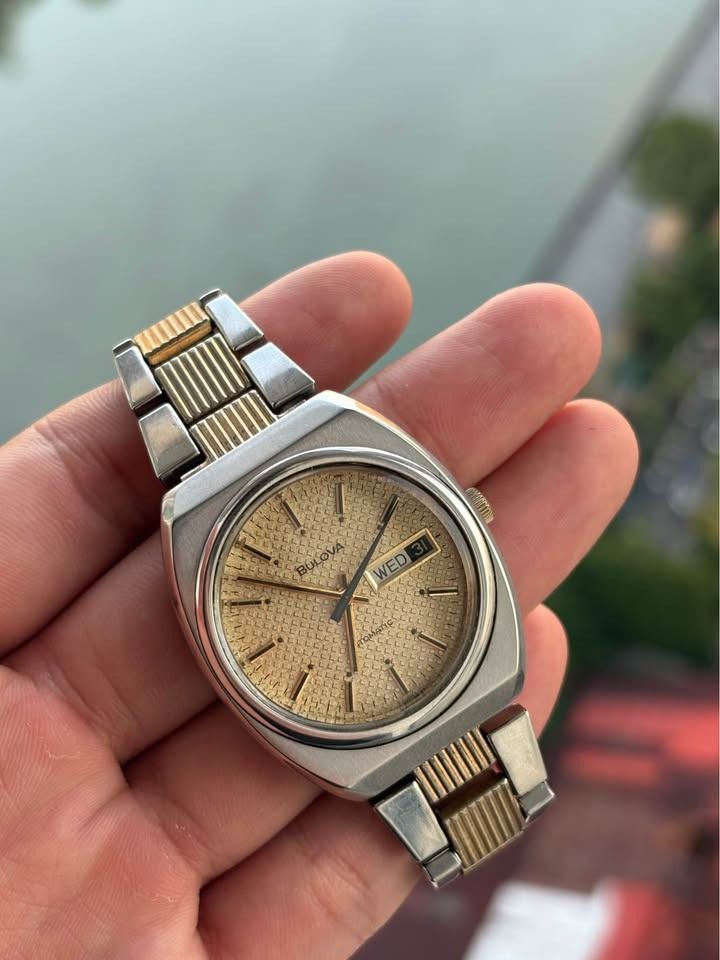 1972 Bulova Automatic Waffle Day-Date (Category: Luxury Watches) located in Manila. Submitted by archi.math (Listing ID 1462179053, Image 3). Description: Automatic Mechanical Movement Day-Date display Stainless steel case Champagne textured dial Applied baton hour markers Distinctive 1970s-style case design Original Bulova two-tone bracelet Omega-style signed clasp Swiss Made Running well & keeping accurate time Fitted on original Bulova two-ton