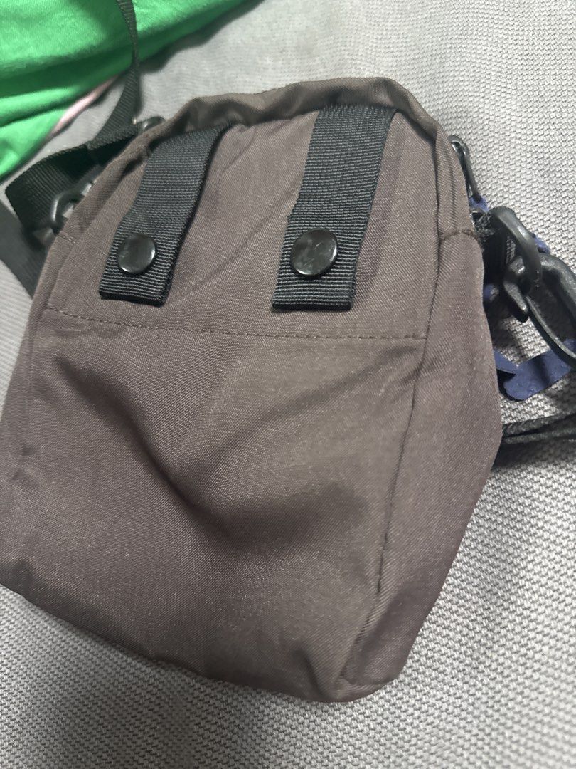 2027 AIGLE Brown Crossbody Bag (Category: Cross-body Bags) located in Silang. Submitted by sari2bilina (Listing ID 1462155659, Image 3). Description: - Brand: AIGLE - Color: Brown - Style: Crossbody bag - Features: Main zippered compartment, front zippered pocket - Strap: Adjustable - Size: Small and compact, approx. 7 inches tall x 5 inches wide - Ideal for: Carrying essentials.