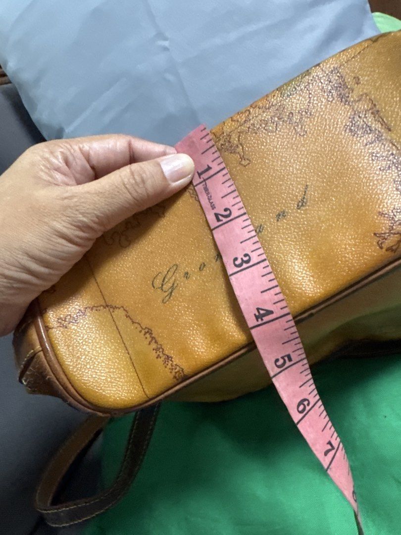 2027 Brown Leather Map Print Shoulder Bag (Category: Shoulder Bags) located in Silang. Submitted by sari2bilina (Listing ID 1462157189, Image 3). Description: - Stylish cool brown leather shoulder bag - Unique all-over map print design - Secure drawstring closure with buckle strap - Durable leather trim and strap - Convenient interior zippered pocket - Approximate dimensions: 10 inches wide x 9 inches tall flaws last 2 pics.