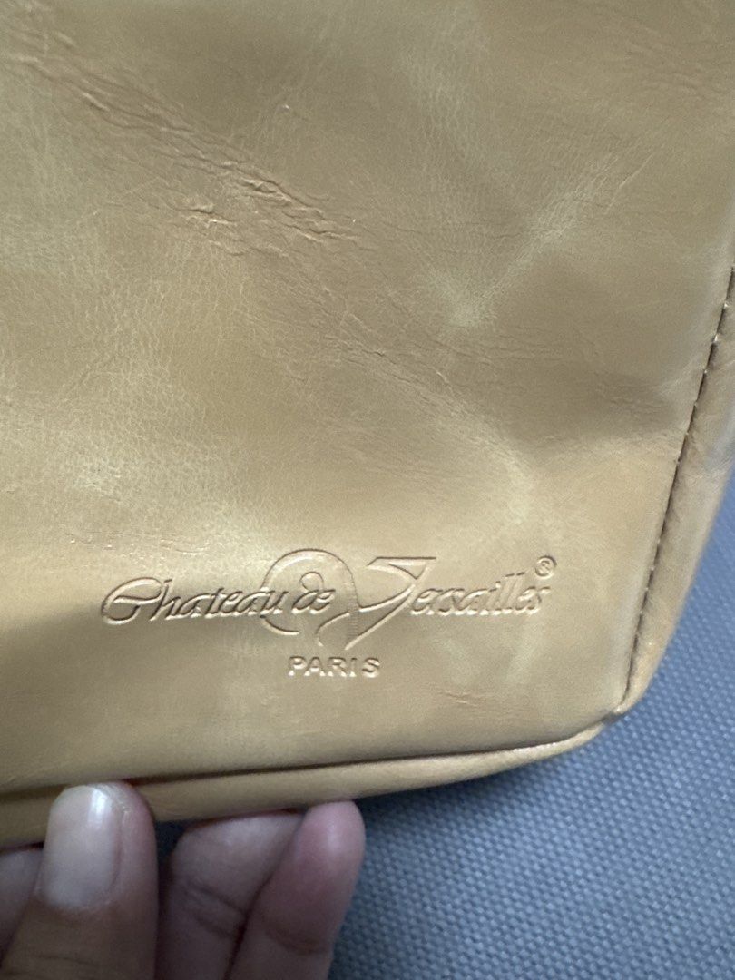 2027 Chateau de Versailles Paris Leather Pouch (Category: Purses & Pouches) located in Silang. Submitted by sari2bilina (Listing ID 1462163961, Image 3). Description: - Authentic Chateau de Versailles Paris pouch - Made of durable tan leather - Secure zipper closure - Features an interior divider for organization.