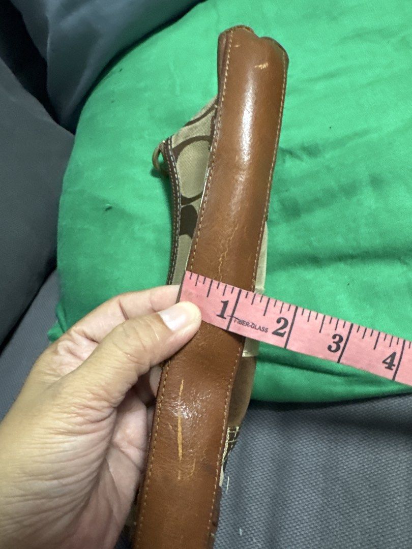 2027 Coach Monogram Canvas & Leather Trim Shoulder Bag (Category: Luxury Bags & Wallets) located in Silang. Submitted by sari2bilina (Listing ID 1462158132, Image 3). Description: - Classic Coach monogram shoulder bag - Brown canvas with leather trim and accents - Signature C pattern - Interior zippered pocket - Leather strap - Approx. measurements: 9" L x 4" H - Ideal size for carrying essentials issue on last 2 pics.