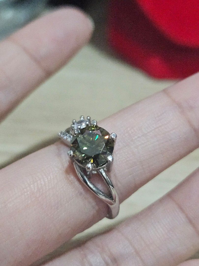 2ct Dark Green Moissanite Stone Simple Ring (Category: Rings) located in Cainta. Submitted by Kahi0410 (Listing ID 1462233760, Image 3). Description: Moissanite Stone Round Brilliant cut PT950 marked Adjustable ring Hypoallergenic Passed Diamond Test.