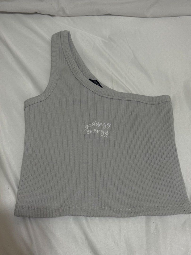 30 EACH, GET ALL 9 TOPS FOR 200 (Category: Others Tops) located in Taguig. Submitted by lovedbynicx (Listing ID 1462136485, Image 3). Description: - White ribbed crop top with rainbow stripes - Grey one-shoulder top with 'goddess energy' embroidery - Green ribbed halter top - Blue floral halter top - White toile print bustier top - Ideal for creating various summer outfits.