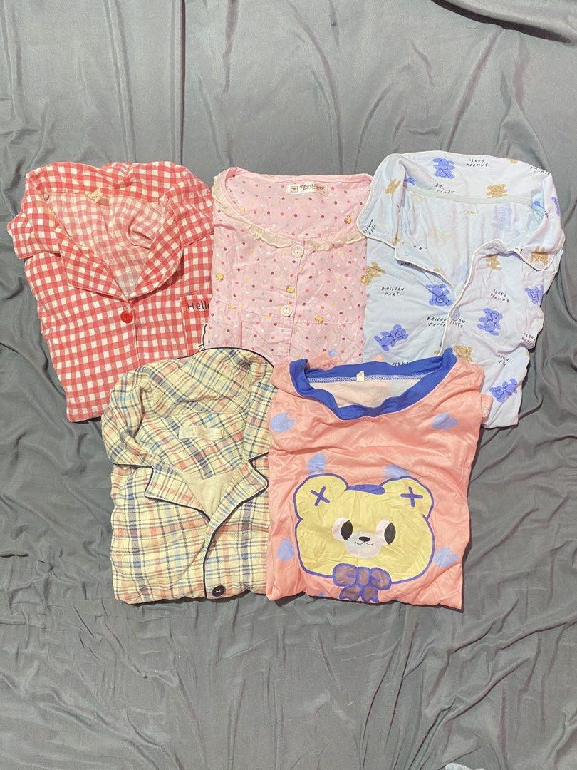 5 for 100, Bundle Cute Pajama Sets - Various Styles and Prints (Category: Undergarments & Loungewear) located in Urdaneta. Submitted by mikaychiii (Listing ID 1462169423, Image 1). Description: - Bundle of cozy pajama tops - Features various cute prints: bears, strawberries, flowers, polka dots - Some tops have button-up fronts and lace details - Ideal for lounging at home or sleeping - Soft and comfortable fabric - Mix and match for versatile lo