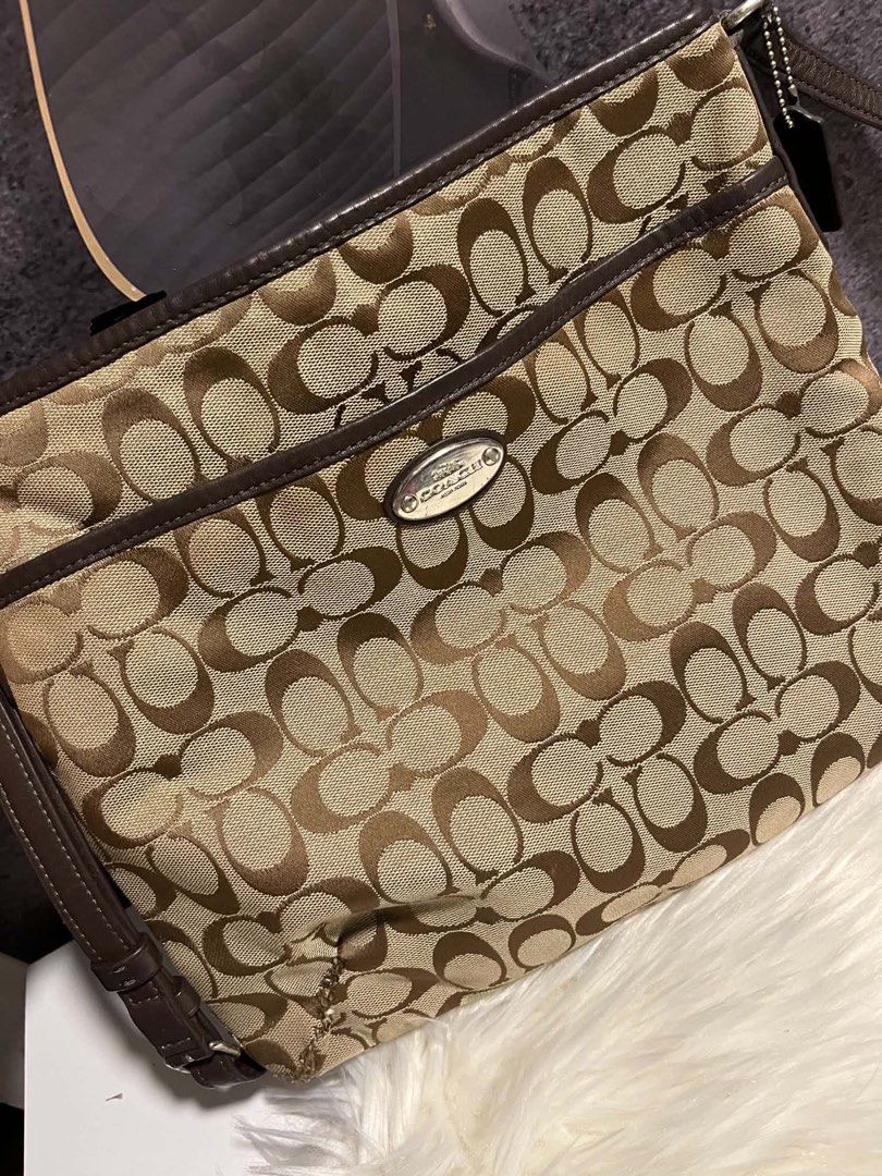 👜 AUTHENTIC COACH BAG — FOR SALE (Category: Cross-body Bags) located in Caloocan City. Submitted by trebdy01 (Listing ID 1462078753, Image 1). Description: 👜 AUTHENTIC COACH BAG — FOR SALE Lightly Used | Good Overall Condition Authentic Coach bag, lightly used and still very nice overall. 🤎 ⚠️ PLEASE READ: One portion of the bag was damaged by a mouse. The damaged area was sewn repaired, as shown clearly in the photos. I’m selling it because I