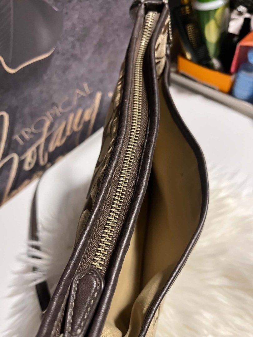 👜 AUTHENTIC COACH BAG — FOR SALE (Category: Cross-body Bags) located in Caloocan City. Submitted by trebdy01 (Listing ID 1462078753, Image 2). Description: 👜 AUTHENTIC COACH BAG — FOR SALE Lightly Used | Good Overall Condition Authentic Coach bag, lightly used and still very nice overall. 🤎 ⚠️ PLEASE READ: One portion of the bag was damaged by a mouse. The damaged area was sewn repaired, as shown clearly in the photos. I’m selling it because I