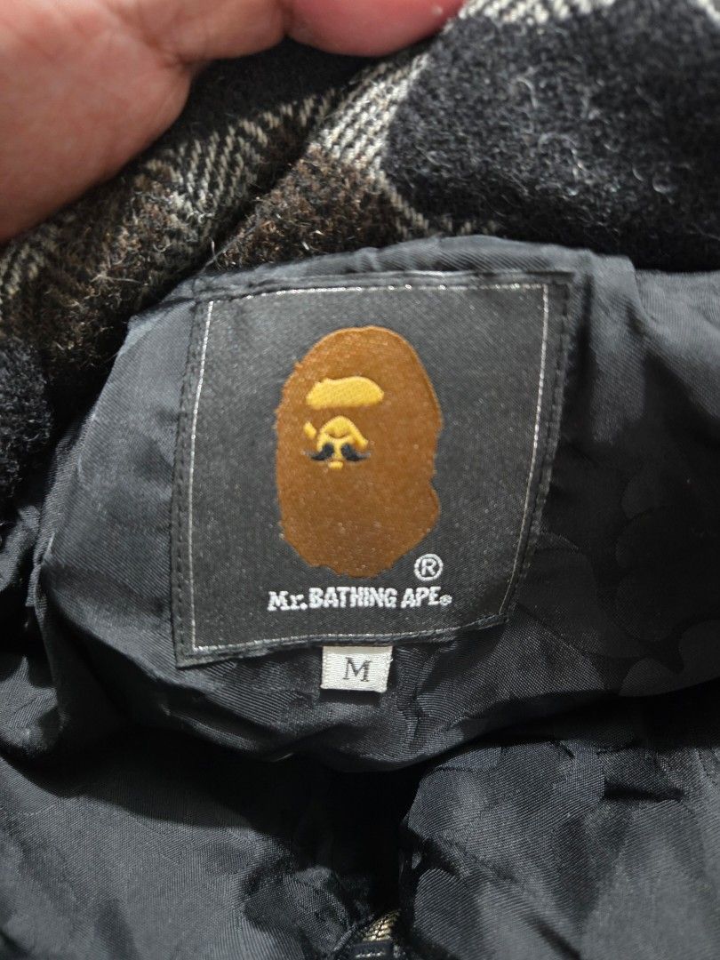 A BATHING APE Camo Wool Down Jacket Size M (Category: Coats, Jackets and Outerwear) located in Baguio. Submitted by muzaffarjahan (Listing ID 1462182377, Image 2). Description: - Authentic BAPE Down Jacket - Eye-catching camouflage pattern - Premium wool blend fabric (90% wool, 10% nylon) - Stylish leather collar accents - Warm and lightweight: 80% down, 20% feather fill - Size: Medium (M) - Made in China - Perfect for staying warm and fashionabl