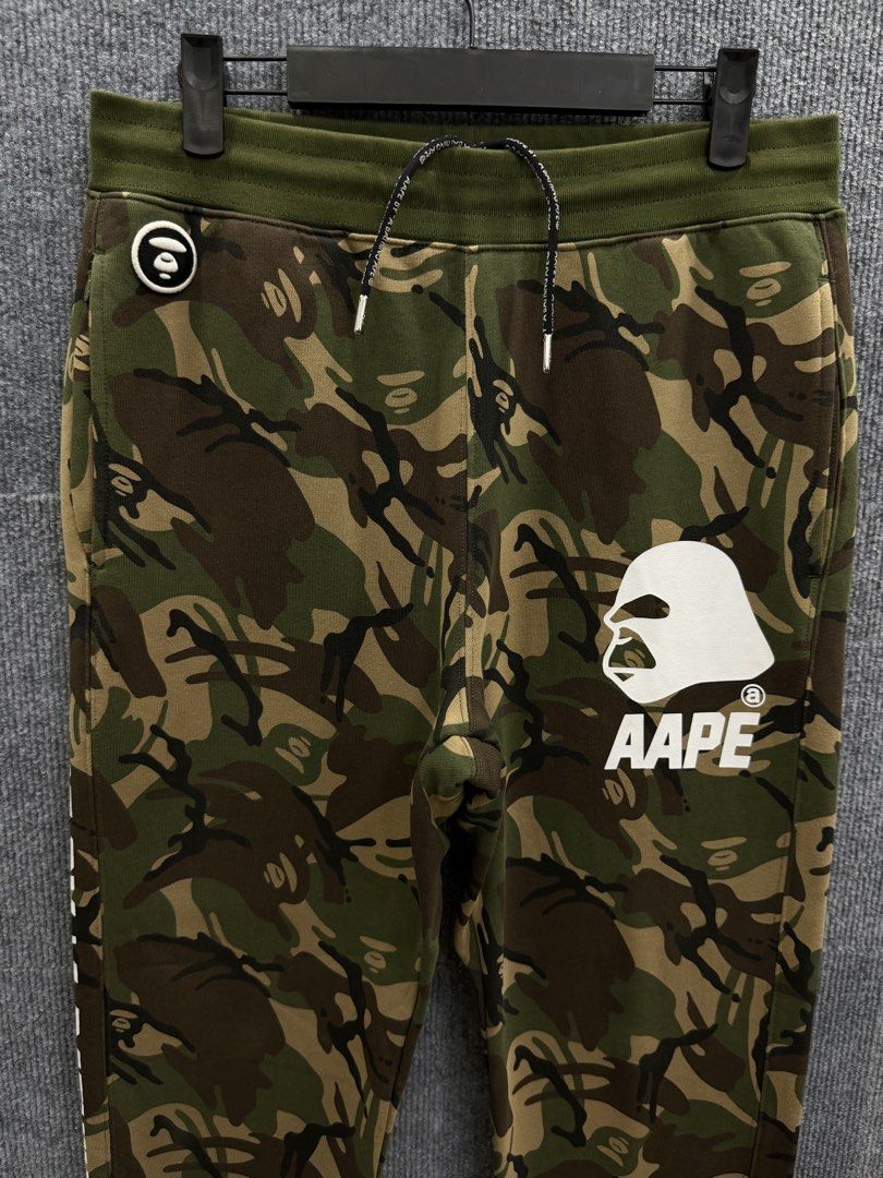 AAPE by A Bathing Ape Camo Jogger Pants (Category: Activewear) located in Marikina City. Submitted by grindmanila (Listing ID 1462108322, Image 2). Description: MENS MED - LARGE FITS✔️ MEDIUM TAG 30 - 34 WAISTLINE 38 LENGTH GOOD AS BRANDNEW✅.