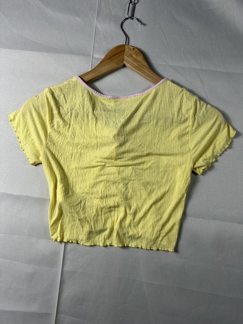 Aape Y2K Cropped Shirt (Category: Others Tops) located in Cabanglasan. Submitted by thefashiongarage.co (Listing ID 1462131944, Image 2). Description: Title - Aape Y2K Cropped Shirt Model/Name - Aape Cropped Size on Tag - XS Conditiion - Excellent Condition - No issue Dimension (LxWxH) - Category- Cropped Shirt Fitting - Made in - China Material - 92% Viscose / 8% Spandex Color - Yellow Design - Aape Cherry Patch Embroide Year - Inclusion - Shirt