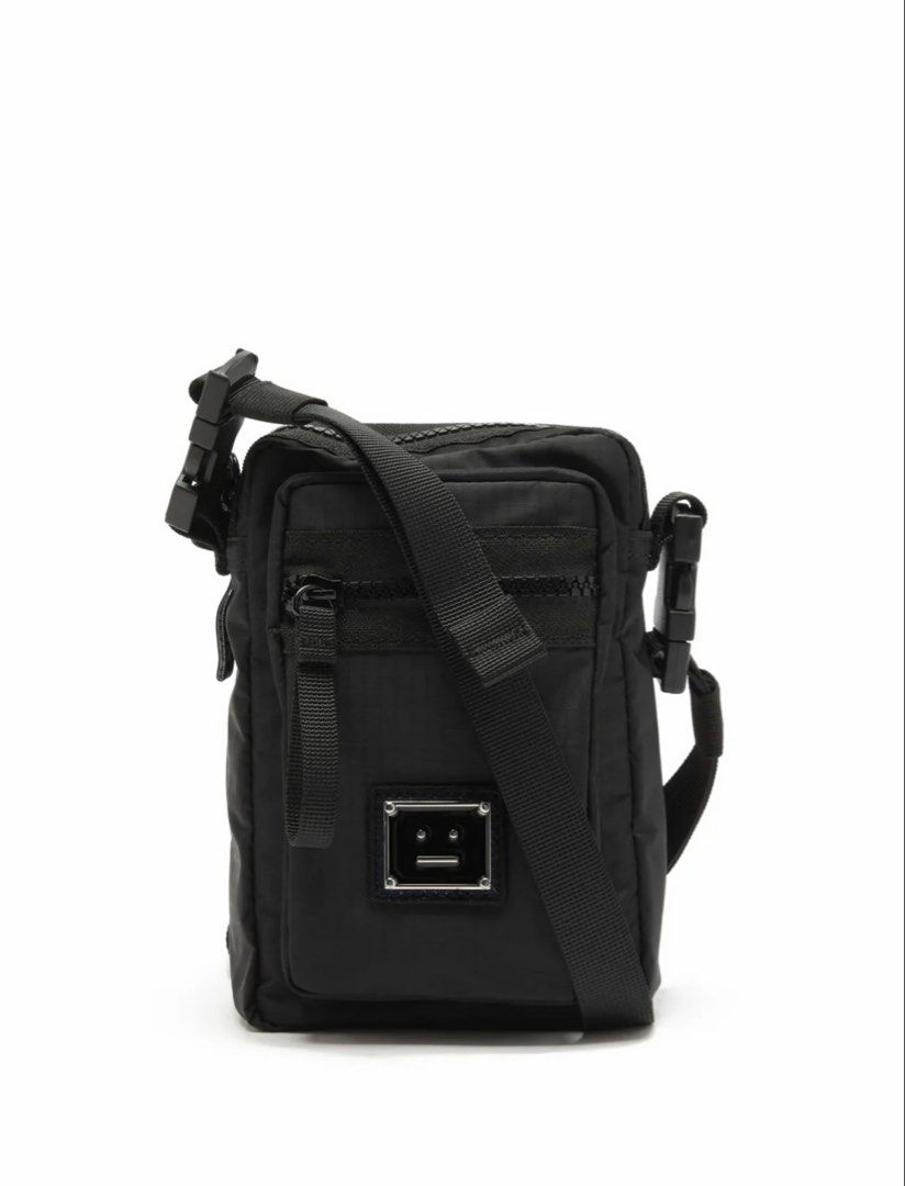 Acne Studios Logo Crossbody Bag (Category: Luxury Bags & Wallets) located in Makati City. Submitted by muffinstuffins (Listing ID 1462114467, Image 1). Description: - Acne Studios black crossbody bag - Features iconic face logo plate - Adjustable strap for comfortable wear - Multiple zip compartments for storage - Durable nylon material - Ideal for everyday use -purchased from Univers for 11k php - used once.