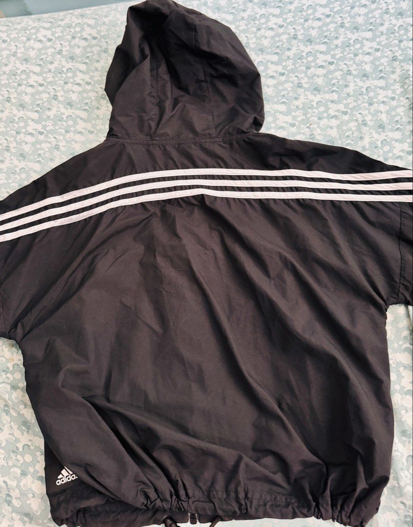 Adidas Black Windbreaker Jacket with 3 Stripes (Category: Coats, Jackets and Outerwear) located in Dumaguete. Submitted by dayvi143 (Listing ID 1462261437, Image 2). Description: - Preloved - Classic black Adidas windbreaker jacket - Iconic 3 stripes on sleeves and back - Built-in hood for extra protection - Adjustable drawstring at the hem for a custom fit - Lightweight material, ideal for layering - Versatile for casual outings or athletic acti