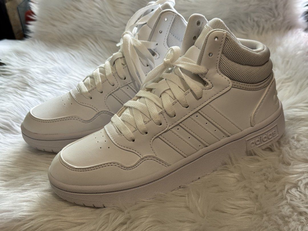 Adidas Hoops Mid White Sneakers (Category: Sneakers) located in Manila. Submitted by sariestore (Listing ID 1462062751, Image 1). Description: - RFS: Decluttering -White Adidas High-Top Sneakers - Size: 5.5 US Women's - Origin: Made in Vietnam - Design: Clean and classic - Perfect for: Everyday wear - Condition: Brandnew No Box included, never been used Mode of payment: Go Tyme/ BPI (Payment first before shipping) Shipping c/of buyer.