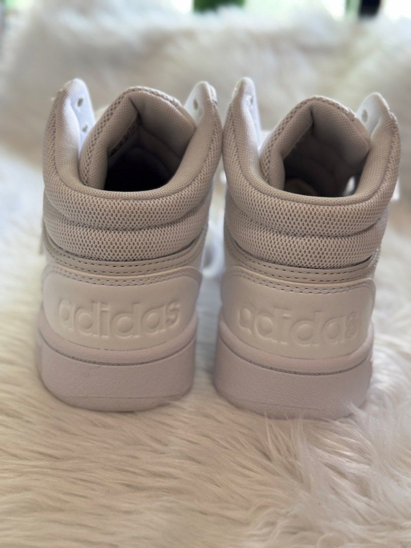 Adidas Hoops Mid White Sneakers (Category: Sneakers) located in Manila. Submitted by sariestore (Listing ID 1462062751, Image 2). Description: - RFS: Decluttering -White Adidas High-Top Sneakers - Size: 5.5 US Women's - Origin: Made in Vietnam - Design: Clean and classic - Perfect for: Everyday wear - Condition: Brandnew No Box included, never been used Mode of payment: Go Tyme/ BPI (Payment first before shipping) Shipping c/of buyer.