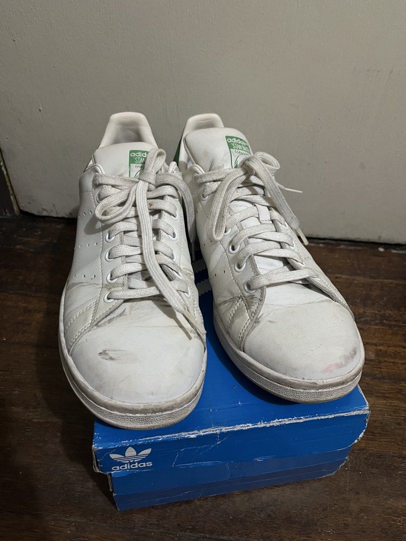 Adidas Stan Smith White Green FX5502 (Category: Sneakers) located in Manila. Submitted by kaitlynnic19015 (Listing ID 1462191121, Image 1). Description: - Classic white Adidas Stan Smith sneakers - Green accents on heel and tongue - Made in Vietnam - Primegreen material - Size: US Men's 9 - Comes with original box - Shows some signs of wear (please check photos) -Need wash RFS: Decluttering.