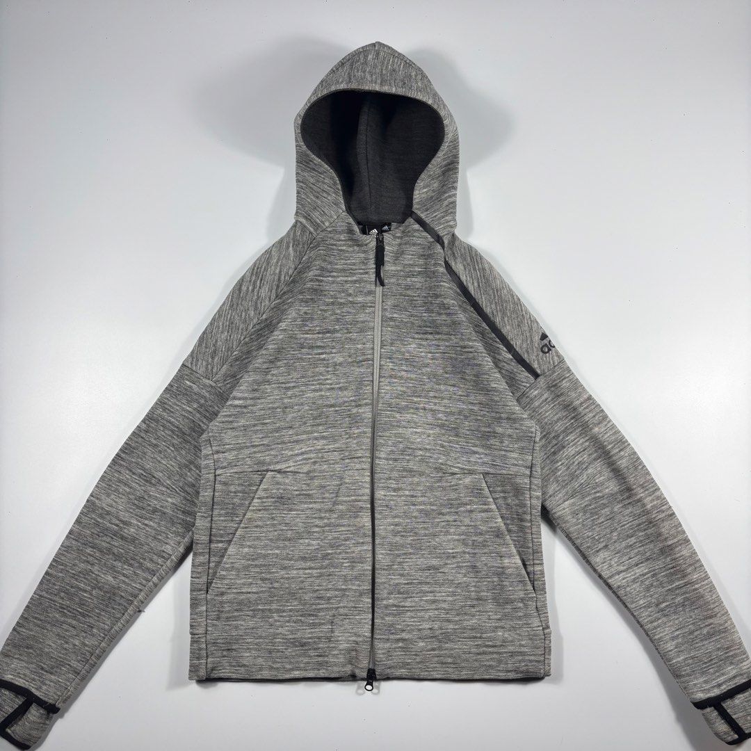 ADIDAS TECH CHARCOAL GRAY ZIP HOODIEg (Category: Coats, Jackets and Outerwear) located in Bulacan. Submitted by etolleneil (Listing ID 1462094394, Image 1). Description: Size: Best fit M-L Dimes: SEE COMSEC. Color rate: 9/10 Issue: see comsec..