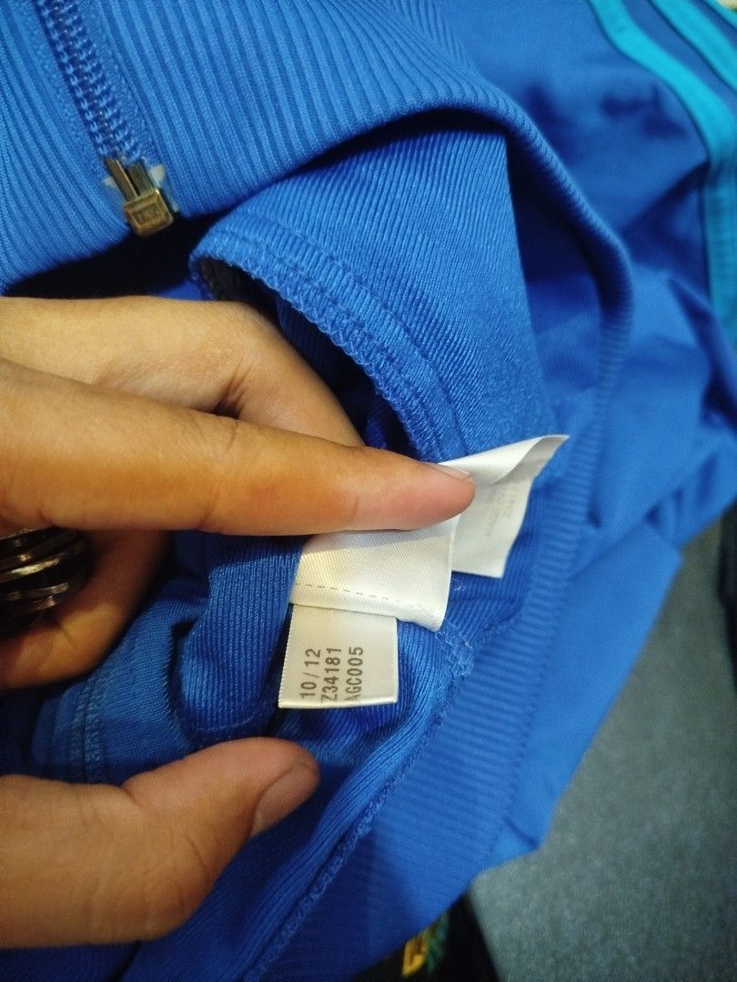 Adidas Track Jacket Blue Trefoil Logo (Category: Coats, Jackets and Outerwear) located in Manila. Submitted by shy177 (Listing ID 1462085378, Image 3). Description: - Classic Adidas track jacket in blue - Iconic trefoil logo - Three stripes on sleeves - Full zip closure - Convenient pockets - Ideal for casual wear or sports - Size: XL.