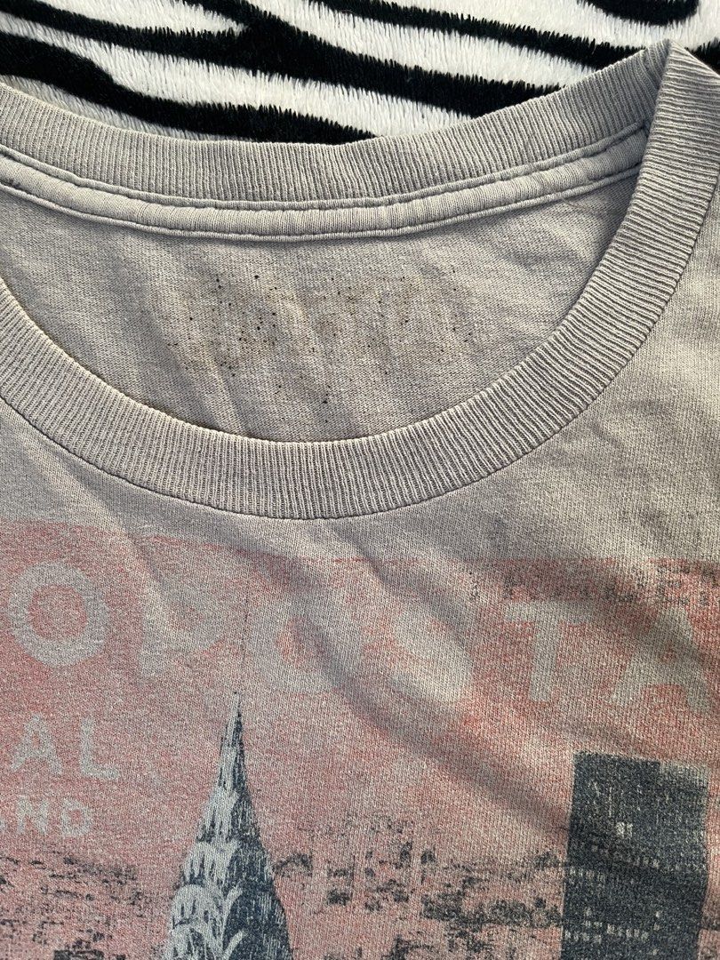 Aeropostale graphic t-shirt (Category: Tshirts & Polo Shirts ) located in Santo Tomas. Submitted by venpineda (Listing ID 1462123406, Image 2). Description: This appears to be a grey Aeropostale graphic t-shirt featuring a faded New York City skyline print with the Chrysler Building and bold “NYC” lettering. single stitching size Xs Length 26 width 17.