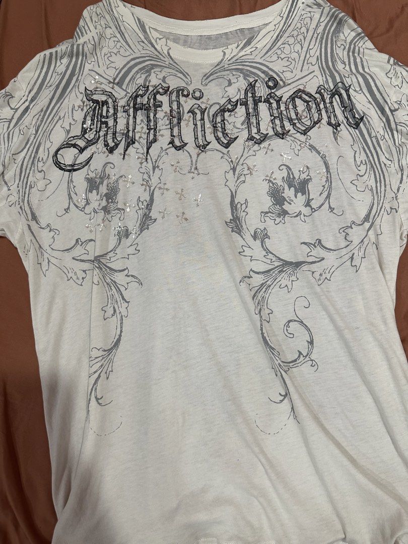 Affliction Grail (Category: Tshirts & Polo Shirts ) located in Pasay City. Submitted by xansells (Listing ID 1462184677, Image 1). Description: 22x31.