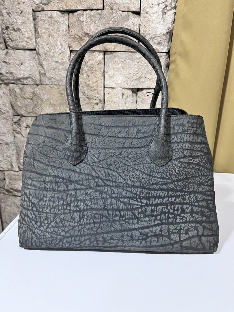African Antelope leather Handbag (Category: Tote Bags) located in Nagcarlan. Submitted by prelovedbymayen (Listing ID 1462102858, Image 1). Description: Gray African Antelope leather handbag. Design Details Texture Details: The deep, horizontal, furrowed lines running across the body are highly characteristic of antelope (shibo) leather. The lower corners show a tighter, micro-pebbled grain pattern, highlighting the natural variance of the authen