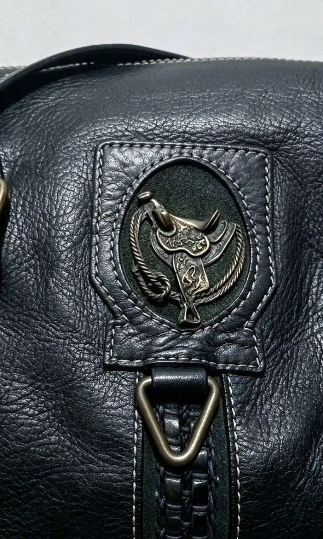 A&G ROCK BAG (Inspo) (Category: Shoulder Bags) located in Tarlac. Submitted by faithfulfinds (Listing ID 1462261842, Image 2). Description: ⚠️⚠️PAMIGAY SALE⚠️⚠️ A&G Rock Bag Black (Inspo) Leather Handbag Condition: Like new / Excellent condition Material: High-quality black leather na may soft texture. Details: Gothic punk aesthetic, heavy-duty hardware,with metal emblem sa front (di ko makita kung ano ang exact image), at functional front zipper
