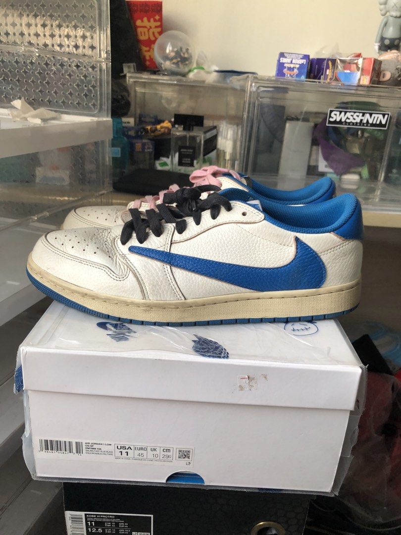Air Jordan 1 Low Travis Scott (Category: Sneakers) located in Manila. Submitted by tan.alejandro.aragon.p (Listing ID 1462120508, Image 2). Description: - Travis Scott Jordan 1 Lows - White leather with blue swoosh and accents - Comes with original box - Includes pink and black laces.