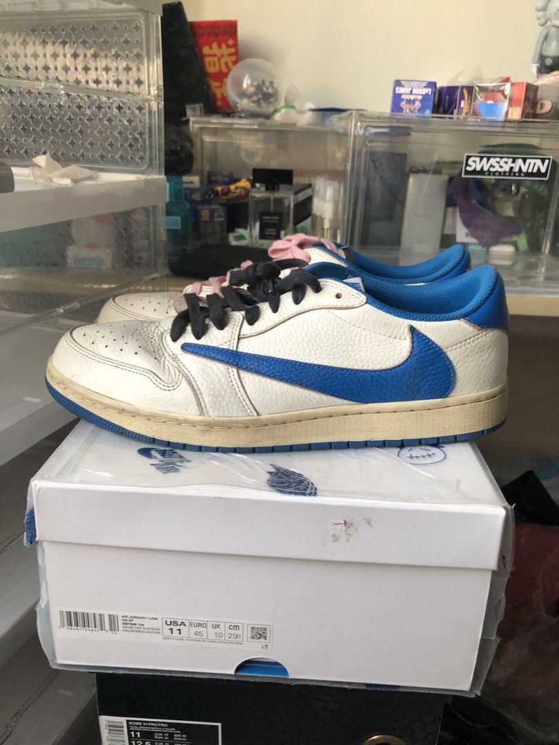 Air Jordan 1 Low Travis Scott (Category: Sneakers) located in Manila. Submitted by tan.alejandro.aragon.p (Listing ID 1462120508, Image 1). Description: - Travis Scott Jordan 1 Lows - White leather with blue swoosh and accents - Comes with original box - Includes pink and black laces.