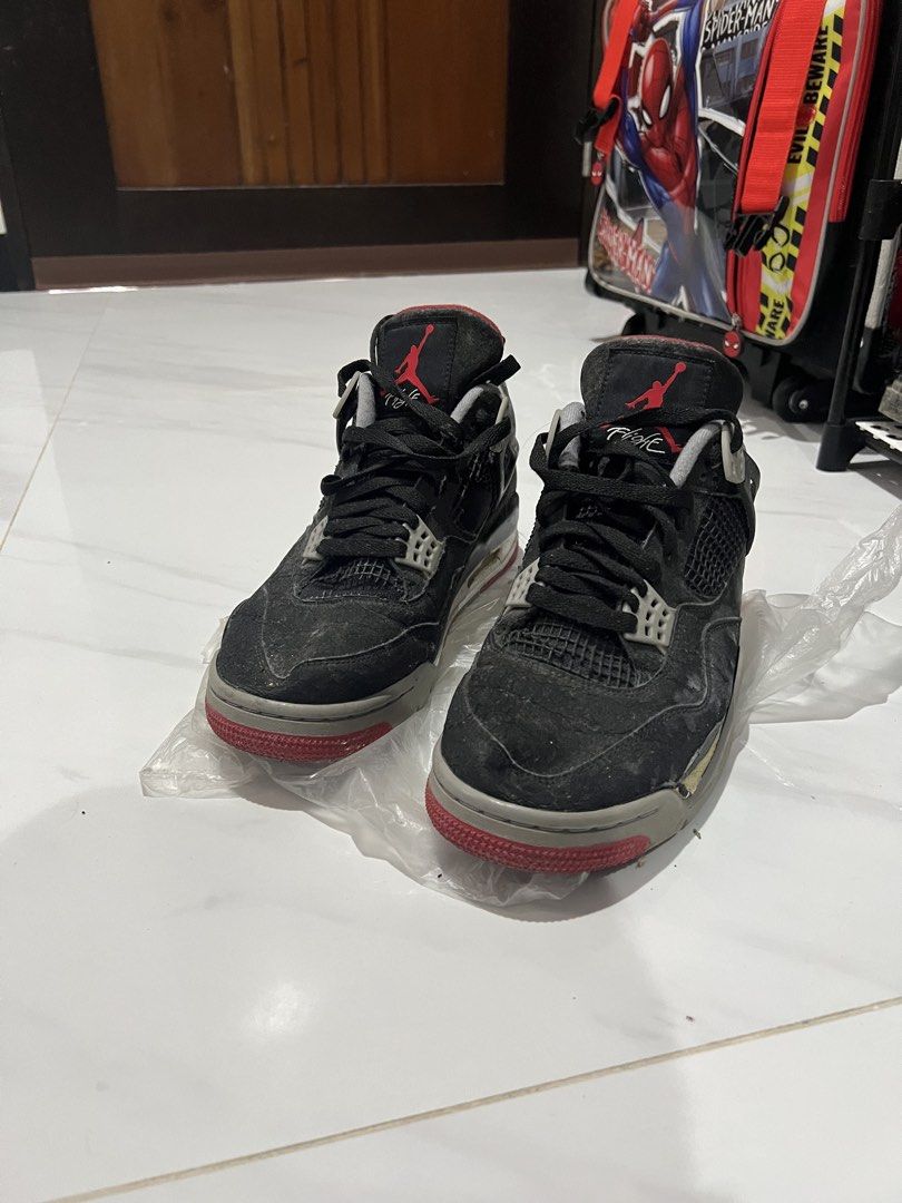 Air Jordan 4 Retro Black Red Cement (Category: Sneakers) located in Manila. Submitted by newfalcon.091f6a (Listing ID 1462120478, Image 1). Description: - Air Jordan 4 Retro sneakers - Color: Black with red and grey accents - Classic silhouette - Ideal for collectors or casual wear - Please check photos for detailed condition.