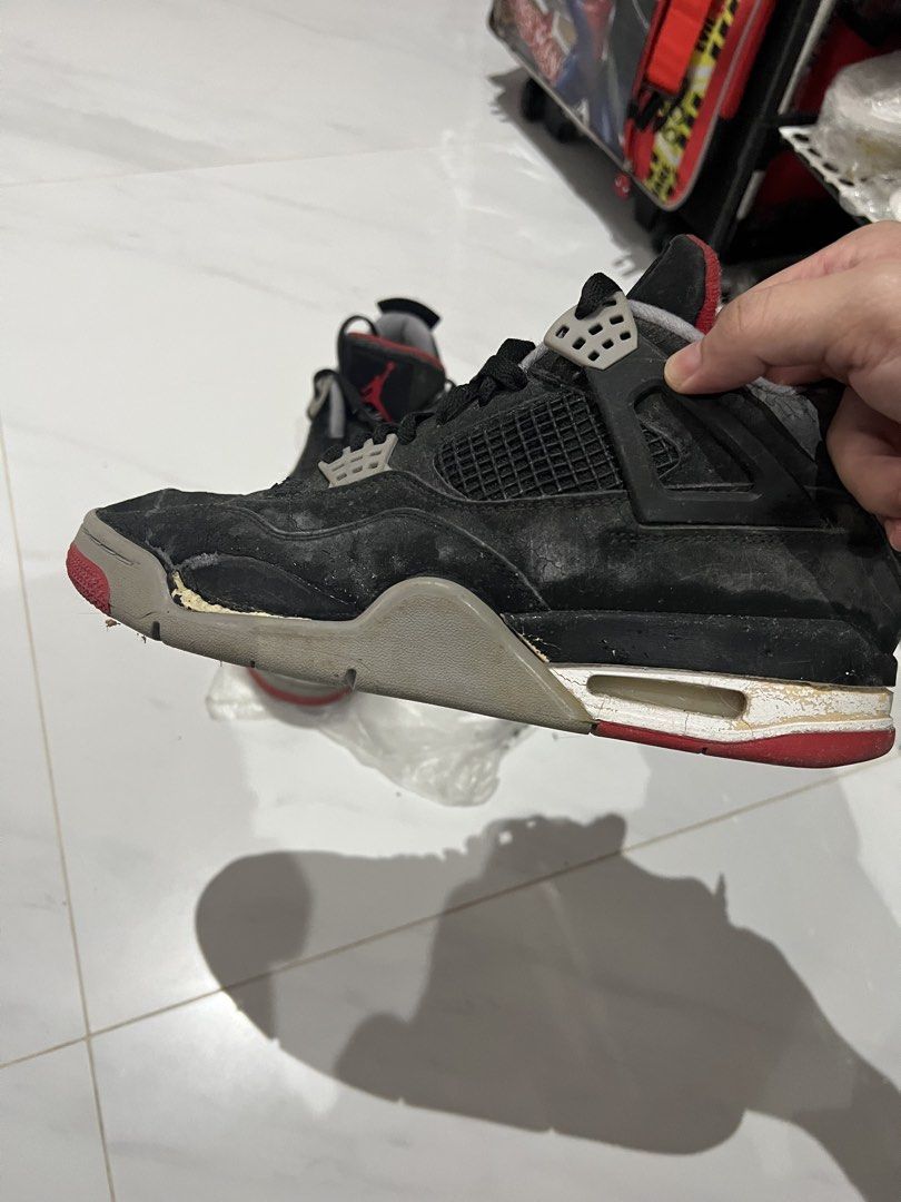 Air Jordan 4 Retro Black Red Cement (Category: Sneakers) located in Manila. Submitted by newfalcon.091f6a (Listing ID 1462120478, Image 2). Description: - Air Jordan 4 Retro sneakers - Color: Black with red and grey accents - Classic silhouette - Ideal for collectors or casual wear - Please check photos for detailed condition.