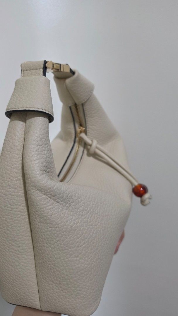 ALBERTO Leather Handbag with strap and dust Bag (Category: Luxury Bags & Wallets) located in Manila. Submitted by knasun15 (Listing ID 1462116149, Image 2). Description: - Cream-colored handbag by ALBERTO - Textured finish - Elegant gold hardware details - Comes with original dust bag and long strap - Features multiple interior compartments - Interior and exterior are clean - Used only once for an event - RFS decluttering.