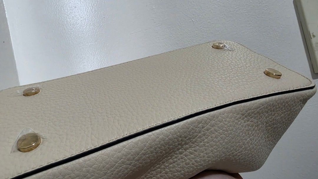 ALBERTO Leather Handbag with strap and dust Bag (Category: Luxury Bags & Wallets) located in Manila. Submitted by knasun15 (Listing ID 1462116149, Image 3). Description: - Cream-colored handbag by ALBERTO - Textured finish - Elegant gold hardware details - Comes with original dust bag and long strap - Features multiple interior compartments - Interior and exterior are clean - Used only once for an event - RFS decluttering.