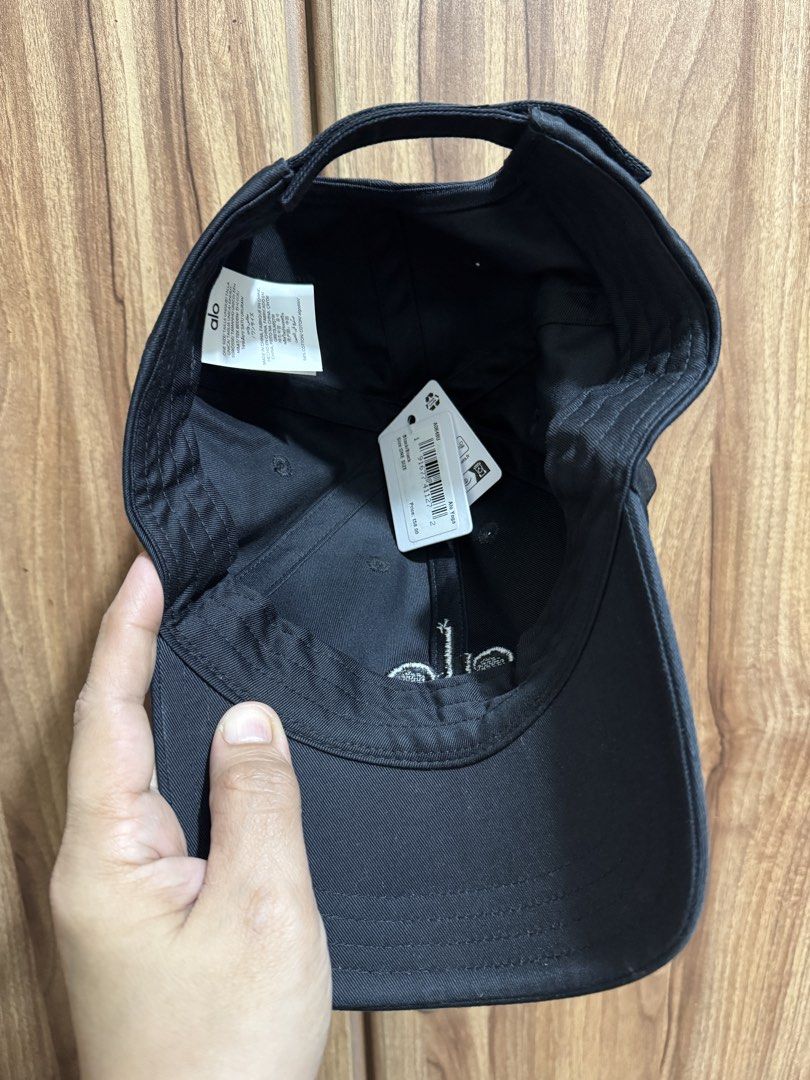Alo Black Baseball Cap (Category: Caps & Hats) located in Manila. Submitted by schumacher14 (Listing ID 1462038552, Image 3). Description: - Classic black Alo cap - Features embroidered Alo logo on the front - Comes with original Alo shopping bag - Adjustable strap at the back for a comfortable fit - Ideal for everyday wear or workouts.