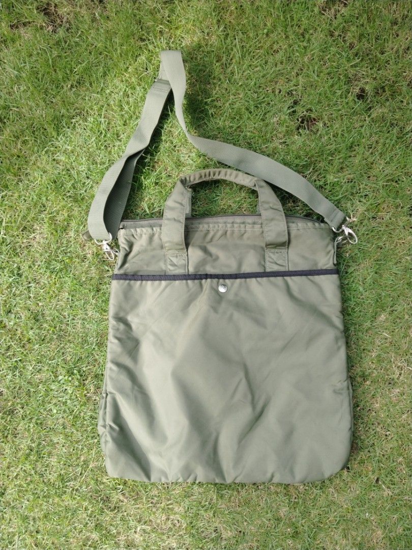 Alpha Industries Tote Bag (Category: Tote Bags) located in Legazpi City. Submitted by genobecollectives (Listing ID 1462136357, Image 2). Description: Alpha Industries tote bag 1200 free ship - Durable nylon construction - Features top handles and a detachable shoulder strap - Multiple front pockets for easy access - Secure zippered main compartment - Vibrant bright orange interior lining - Ideal for everyday use and travel.