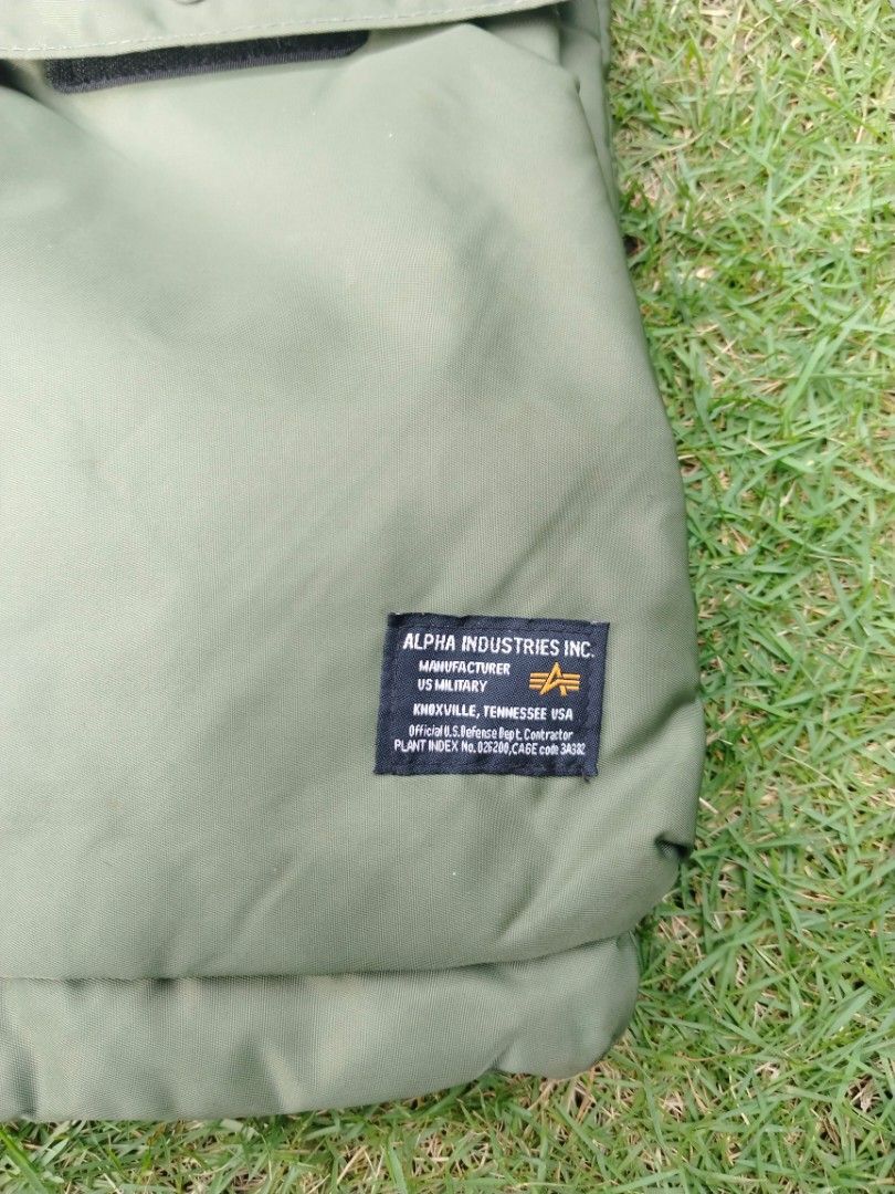 Alpha Industries Tote Bag (Category: Tote Bags) located in Legazpi City. Submitted by genobecollectives (Listing ID 1462136357, Image 3). Description: Alpha Industries tote bag 1200 free ship - Durable nylon construction - Features top handles and a detachable shoulder strap - Multiple front pockets for easy access - Secure zippered main compartment - Vibrant bright orange interior lining - Ideal for everyday use and travel.