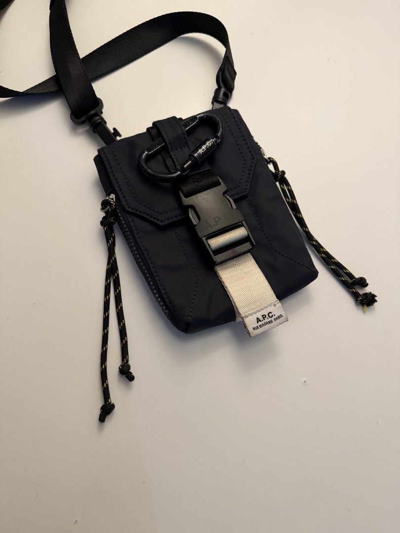 A.P.C. Trek messenger bag (Category: Cross-body Bags) located in Manila. Submitted by jeonjungoo (Listing ID 1462180837, Image 1). Description: still in great condition! barely used, except for the carabiner which i used for my keys lol - Navy blue A.P.C. crossbody bag - Durable nylon material - Secure buckle closure - Adjustable straps for comfort - Back pocket with fields for name, address, phone, and email - Includes a carabiner clip - Ideal f