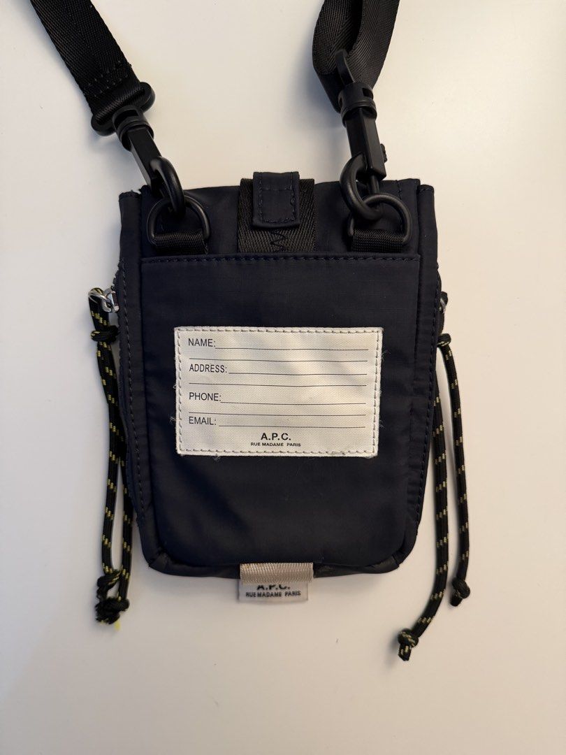 A.P.C. Trek messenger bag (Category: Cross-body Bags) located in Manila. Submitted by jeonjungoo (Listing ID 1462180837, Image 3). Description: still in great condition! barely used, except for the carabiner which i used for my keys lol - Navy blue A.P.C. crossbody bag - Durable nylon material - Secure buckle closure - Adjustable straps for comfort - Back pocket with fields for name, address, phone, and email - Includes a carabiner clip - Ideal f