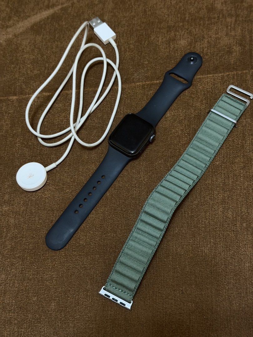 Apple Watch SE 40mm (Category: Wearables & Smart Watches) located in Quezon City. Submitted by copthis___ (Listing ID 1462057799, Image 1). Description: - Apple Watch SE (40mm, Aluminum Case) - Good working condition - Includes original Sport Band - Comes with an extra Green Sport Loop band - Original charger included - Selling due to upgrade - No box.