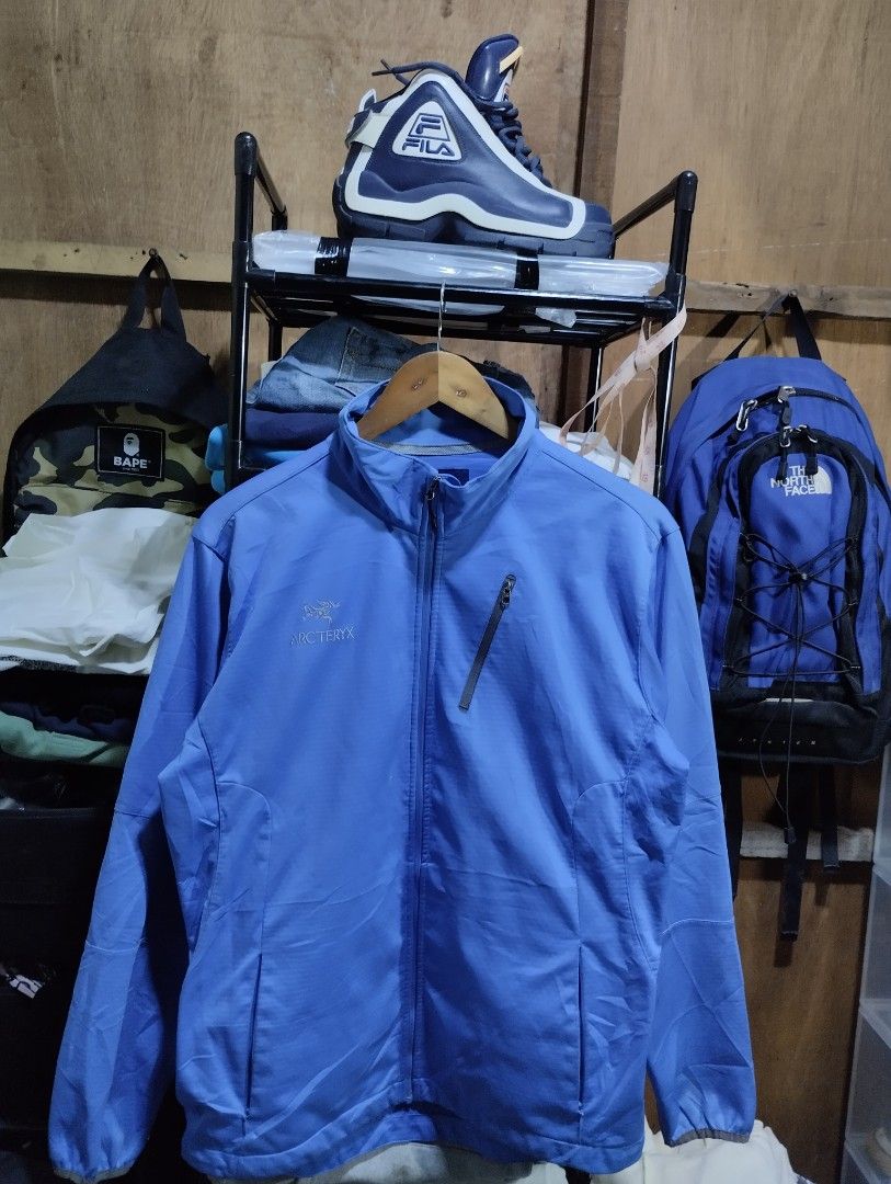 Arc'teryx Vintage Soft Shell Jacket XL Blue (Category: Coats, Jackets and Outerwear) located in Manila. Submitted by niggzreyno51476 (Listing ID 1462059516, Image 2). Description: - Vintage Arc'teryx Soft Shell Jacket - Size: XL -Width 22 Length 27 - Lightweight and durable construction - Water-resistant material - Ideal for hiking and outdoor adventures - Full zip closure with high collar - Elastic cuffs for a snug fit - Convenient chest zip poc