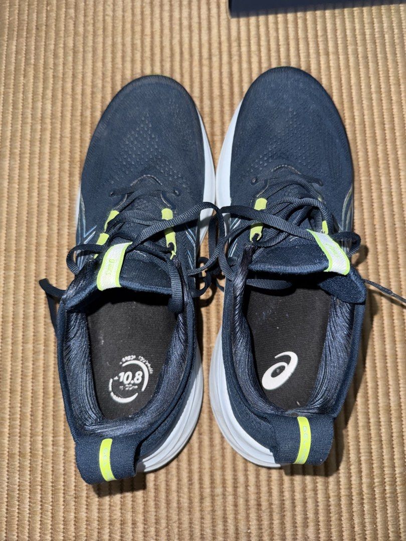ASICS Men's Running Shoes (Category: Sneakers) located in Makati City. Submitted by lgramos1496 (Listing ID 1461375419, Image 2). Description: Selling Asics Gel Nimbus 65 - Dark blue ASICS running shoes - Neon yellow accents - Features PureGEL technology - Includes original box - Ideal for running Rfs - not being used anymore. Can meet up - podium mall - estancia mall - festival mall.