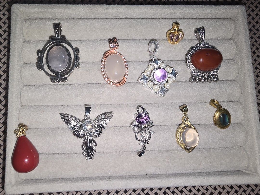 Assorted Gemstone and Crystal Pendants Collection (Category: Charms) located in Santa Rosa. Submitted by crystal1.0 (Listing ID 1462119542, Image 1). Description: Selling a collection of beautiful pendants. Includes rose quartz, amethyst, carnelian, and other stones. Various designs like angel, crown, and teardrop shapes. Some feature intricate metalwork and small crystals. Great for jewelry making or adding to your collection. Each piece has a u