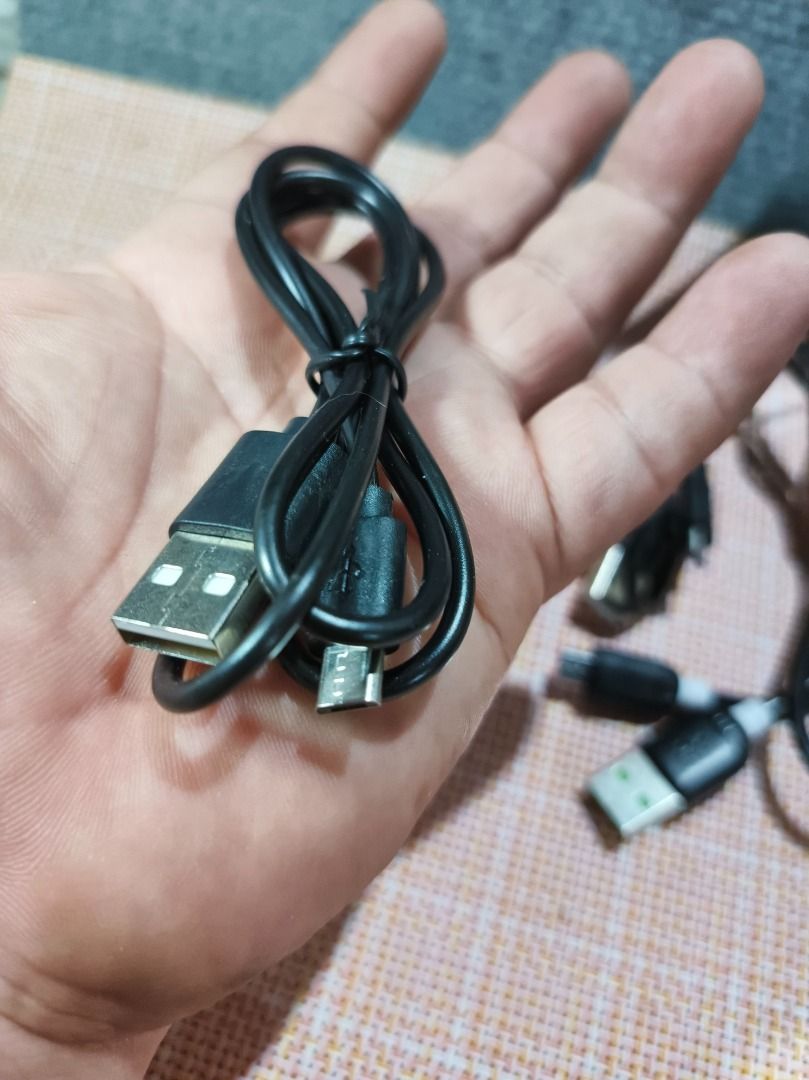 Assorted USB Charging & Audio Cable Bundle (5-Piece Lot) (Category: Chargers & Cables) located in San Leonardo. Submitted by burgossanleonardo.12345 (Listing ID 1462191226, Image 3). Description: Description:Selling a bundle of 5 useful electronic cables in good condition. Great to keep as spares for your home, car, or office!The lot includes:2x Standard Micro-USB Cables (Black)1x Dual-Split Micro-USB Charging Cable (Black)1x Apple iPhone Lightni